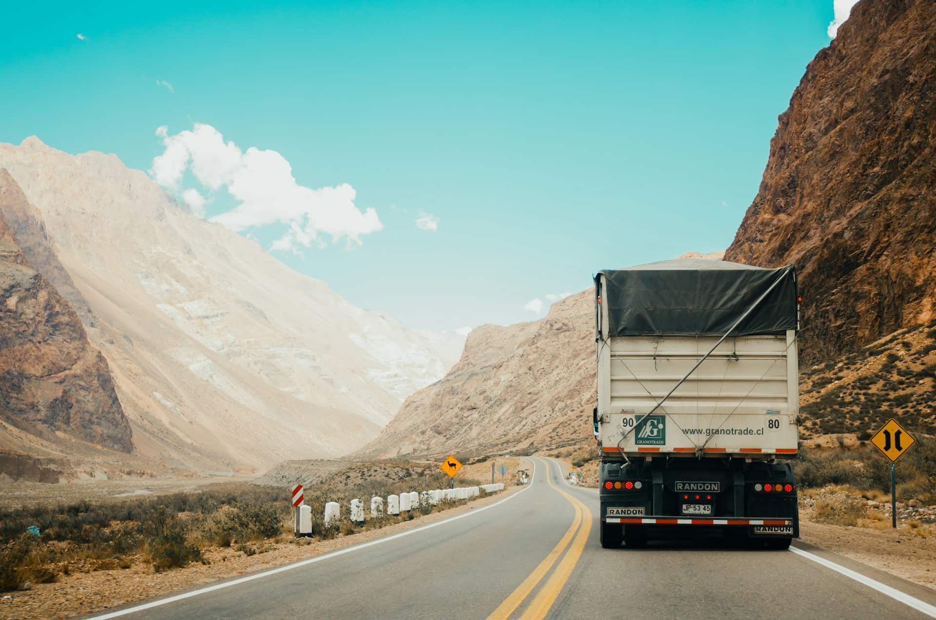 A freight truck climbing a mountain highway